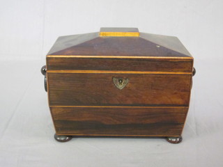 A Victorian rosewood twin compartment tea caddy of  sarcophagus form and ring drop handles, raised on bun feet 7  1/2"