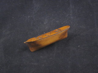 A 19th Century wooden snuff box in the form of a ships hull 4"