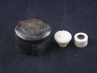 A circular carved ivory trinket box in the form of a basket 1", 1  other trinket box 1" and a circular horn trinket box