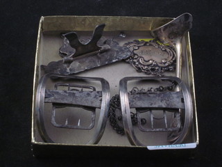 A pair of Georgian sliver shoe buckles, a childs silver pusher, a place card holder and 2 decanter labels