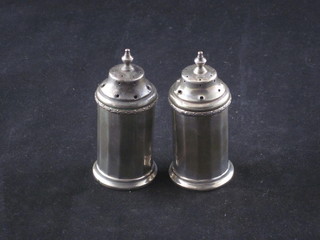 2 Mappin & Webb Art Deco cylindrical silver peppers,  Birmingham 1934, 3 ozs