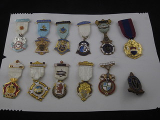 12 various gilt metal and enamel Masonic charity jewels