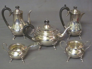 A circular silver 5 piece tea/coffee service with shaped borders, raised on hoof feet comprising teapot, hotwater jug, coffee pot,  twin handled sugar bowl and cream jug, London 1927 and 1928  by the Goldsmiths & Silversmiths Company 58 ozs, together with  a set of 5 silver plated fiddle pattern teaspoons   ILLUSTRATED