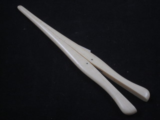 A pair of ivory glove stretchers