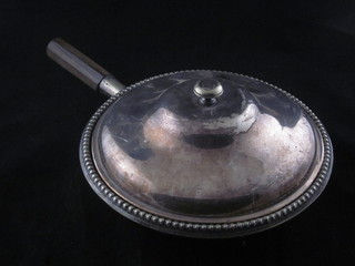 A circular entree dish and cover with bead work border