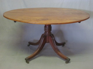 A 19th Century oval mahogany breakfast table raised on pillar  and tripod base 53"  ILLUSTRATED