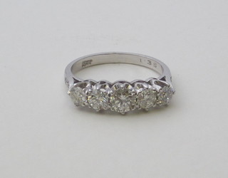 A lady's 18ct white gold dress/engagement ring set 5 diamonds,  approx. 1.35ct