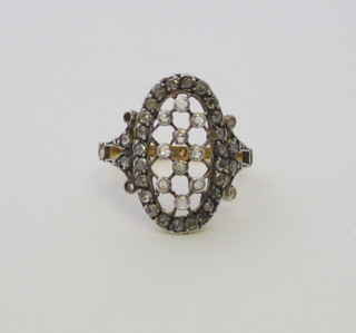A lady's pierced 18ct gold dress ring set diamonds