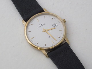 A gentleman's quartz wristwatch by Garrard contained in a gold case