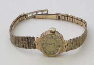 A lady's Rotary wristwatch contained in a 9ct gold case with integral bracelet