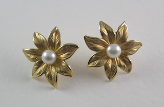 A pair of floral gilt metal earrings set pearls