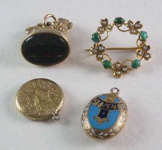 A gilt metal seal, a circular brooch and 2 lockets