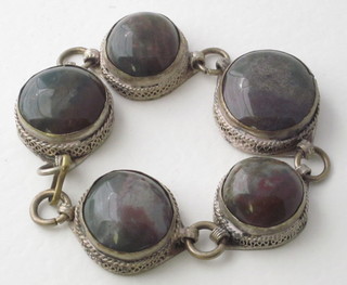 A silver bracelet set cabouchon cut stones