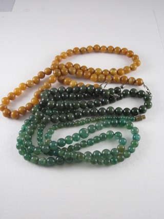 2 strings of green hardstone beads and a string of hardstone beads
