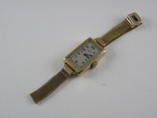 A cocktail wristwatch by J W Benson, contained in a 9ct gold  case with integral bracelet