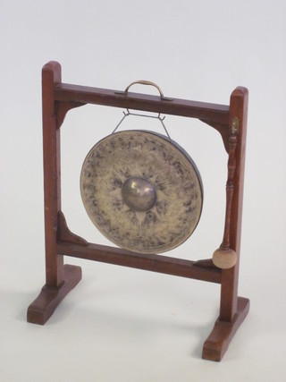 A tea gong raised on a stand 18"