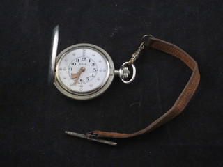 An RNIB Braille pocket watch contained in a silver case