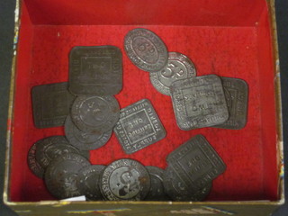A quantity of various metal Co-Operative store tokens
