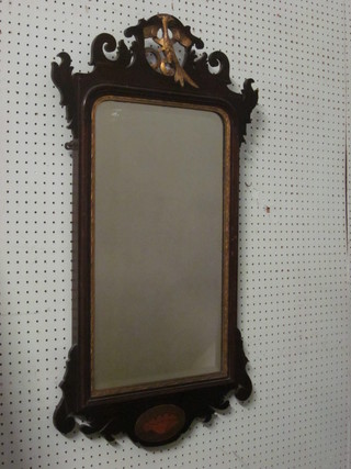 A Chippendale style rectangular bevelled plate mirror contained in a mahogany frame surmounted by a figure of an eagle 36"