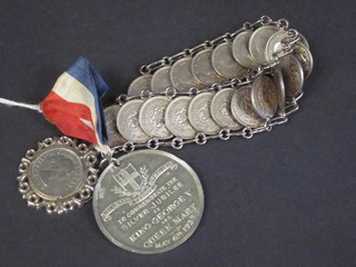 A bracelet formed from sixpences, a sixpence pendant and a  George V unofficial Coronation medal