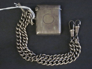 A silver curb link double Albert watch chain together with a silver vesta case