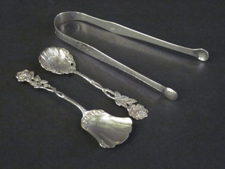 A pair of Georgian silver bright cut sugar tongs and 2  Continental spoons