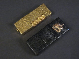 A gold plated Dunhill lighter complete with leather case