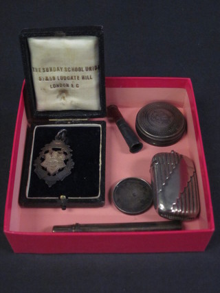 2 silver watch chain medallions, 2 silver pencil holders, a silver dressing table jar lid, a cheroot holder and a vesta case