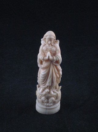 A carved ivory figure of a standing lady 4 1/2"