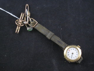 2 gold bar brooches, a lady's wristwatch in a gold case and a ring set a green hardstone