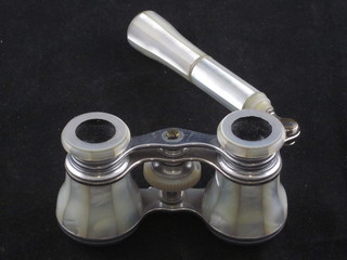A pair of opera glasses contained in a mother of pearl case