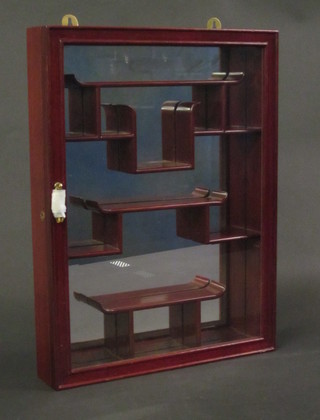 An Oriental hardwood display cabinet fitted shelves, 15"