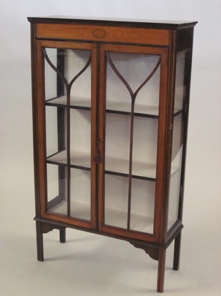 An Edwardian inlaid mahogany display cabinet enclosed by  astragal glazed panelled doors 30", possibly cut down,