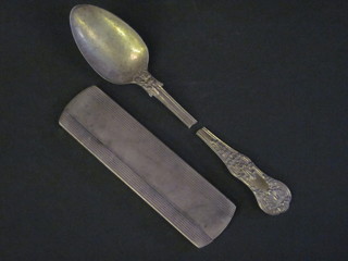 A silver cased comb and a silver spoon