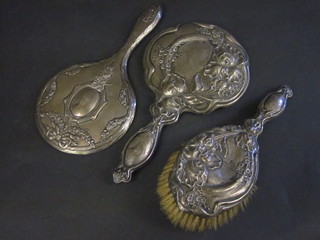 2 silver backed hand mirrors and a hair brush