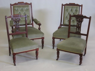An Edwardian walnut 4 piece drawing room suite comprising  open arm chair, nursing chair and 2 side chairs with upholstered  green seats, raised on turned and fluted supports
