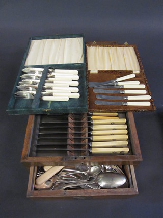 A set of 5 silver plated fish knives and forks cased and an oak canteen box containing a collection of various flatware