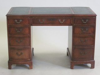 A Victorian style kneehole pedestal desk with inset tooled writing  surface above 1 long and 8 short drawers, raised on bracket feet  45"