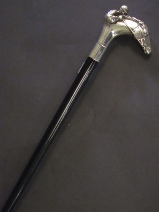 An ebony walking cane, the handle in the form of a race horse  with jockey up, marked 925