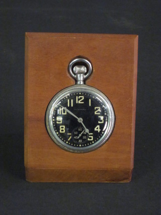 A Waltham open faced pocket watch contained in a chrome case complete together with a wooden watch stand