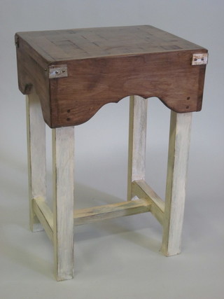 A rectangular Butcher's block raised on a painted stand 21"