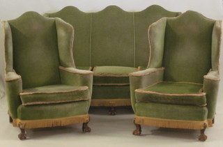 A Queen Anne style beech framed 3 piece suite comprising  winged triple chair back settee and pair of winged armchairs  upholstered in green material