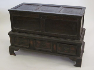 An oak "mule" chest of panelled construction, the associated base fitted 3 drawers, 42"