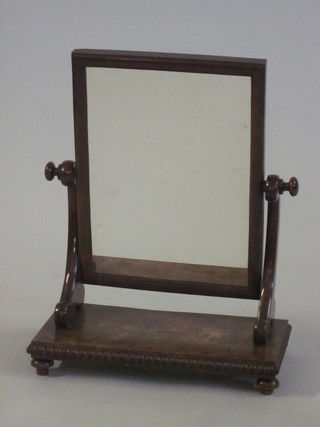 A Victorian rectangular plate dressing table mirror contained in a mahogany swing frame 19"