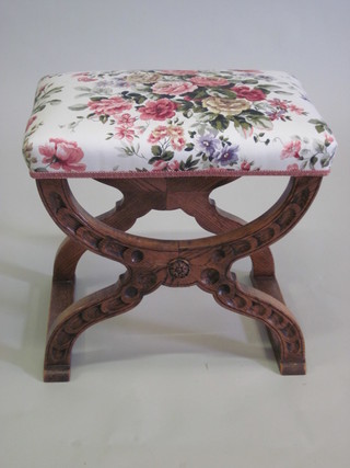 A carved oak X framed stool 21"