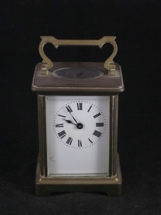 A 19th Century French mantel clock with enamelled dial and Roman numerals contained in a gilt metal case   ILLUSTRATED