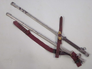 2 metal sword scabbards 35" and 33 1/2", 1 with sword belt