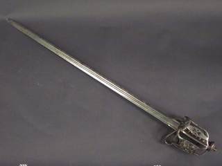 An 18th Century Scots broadsword with 34" blade, having a  pierced basket hilt  ILLUSTRATED