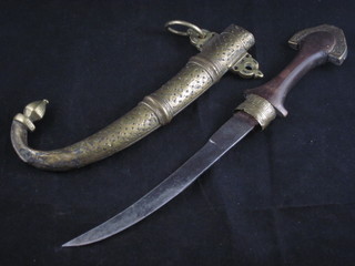 A Jambuka style dagger with wooden grip and 9" blade,  contained in a wooden scabbard
