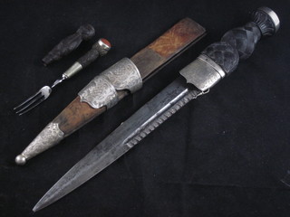 A Scots Durk set with orange hardstones with 9 1/2" blade  contained in a wooden scabbard, f, complete with knife and fork,  knife blade missing